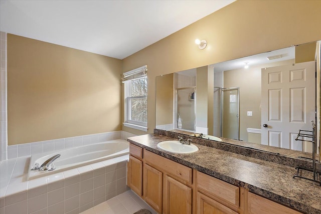 full bathroom with tile patterned floors, vanity, toilet, and independent shower and bath