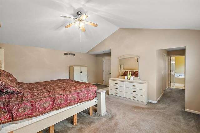 bedroom with connected bathroom, ceiling fan, carpet, and lofted ceiling