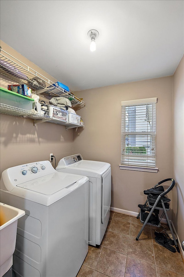 laundry area with washing machine and dryer and sink