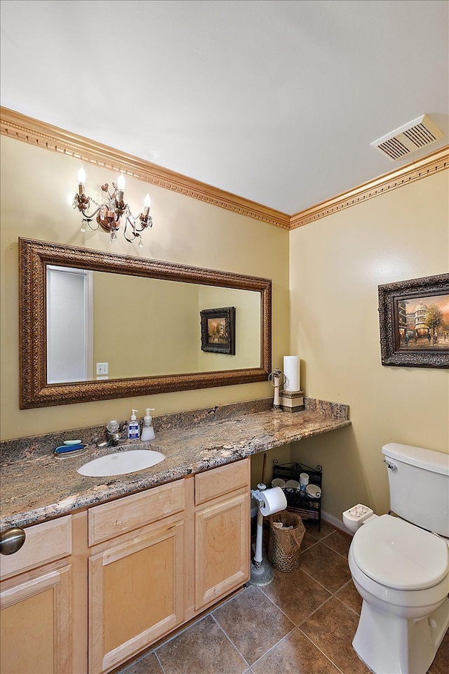 bathroom featuring tile patterned floors, vanity, and toilet