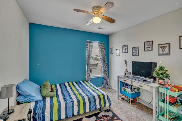 carpeted bedroom with ceiling fan