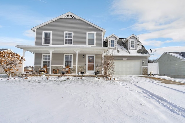 view of front of home featuring covered porch and a garage