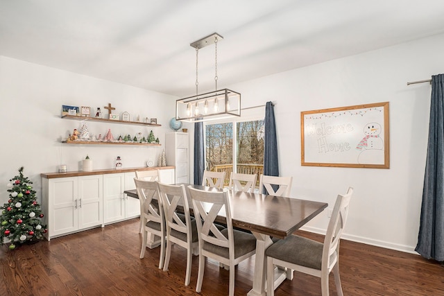 dining space with dark hardwood / wood-style floors