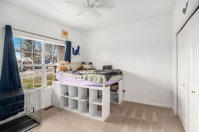 bedroom featuring carpet floors, a closet, and ceiling fan