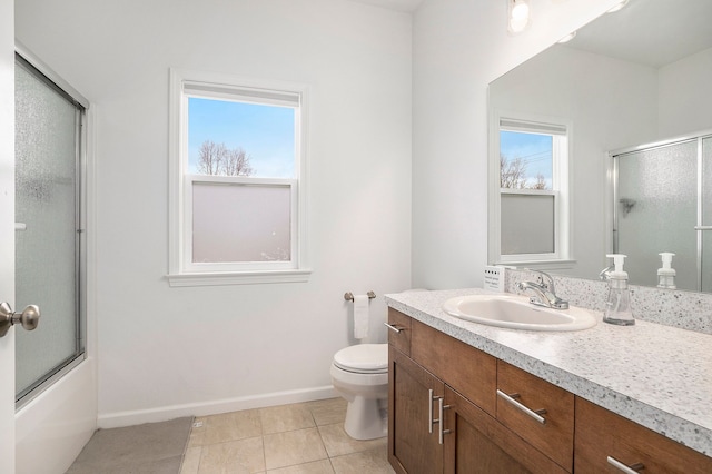 full bathroom with tile patterned floors, vanity, toilet, and enclosed tub / shower combo