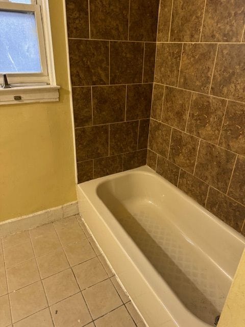 bathroom featuring tile patterned flooring and tub / shower combination