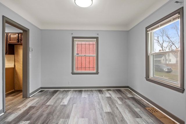 empty room featuring hardwood / wood-style flooring