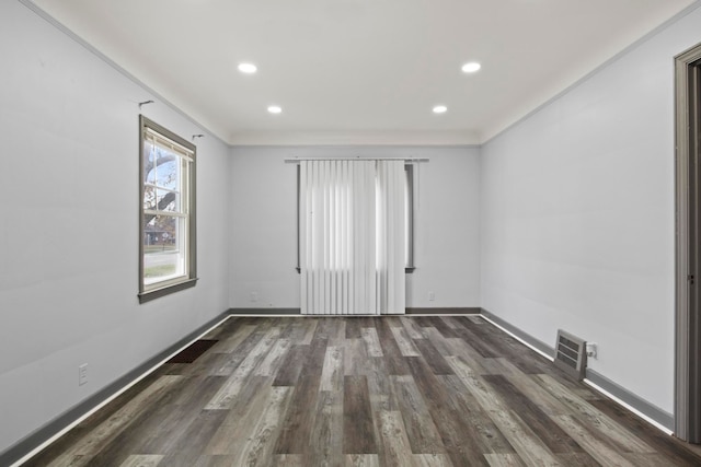 spare room with dark hardwood / wood-style floors