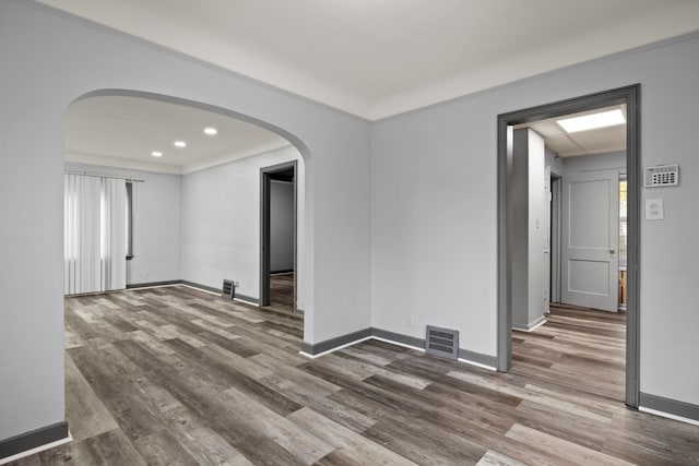 empty room featuring wood-type flooring