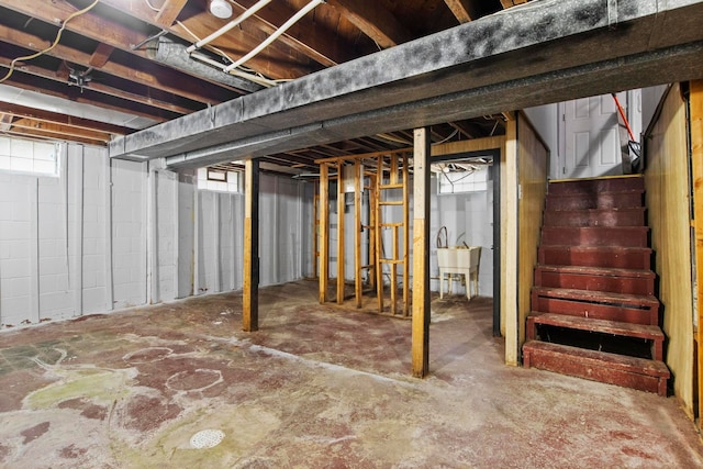 basement with a wealth of natural light and sink