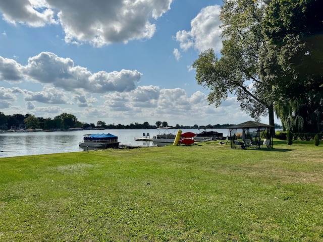 exterior space featuring a gazebo and a dock