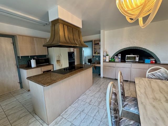 kitchen featuring light brown cabinets, pendant lighting, decorative backsplash, black appliances, and custom range hood