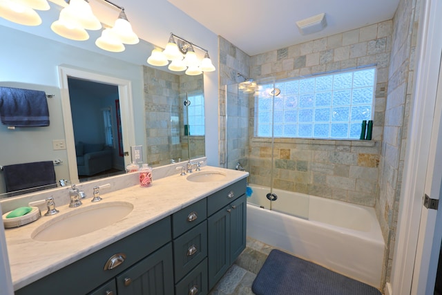 bathroom featuring vanity and bath / shower combo with glass door