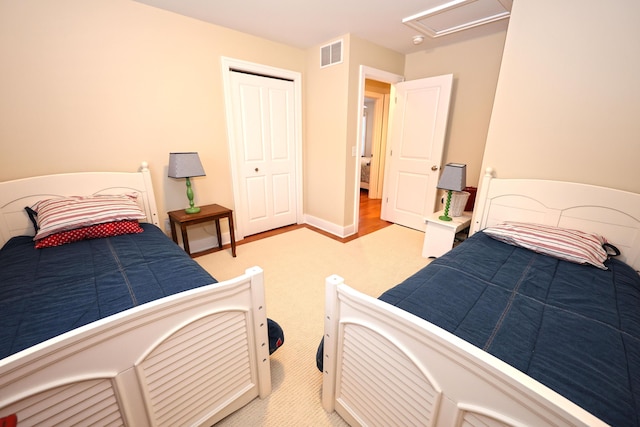 carpeted bedroom featuring a closet