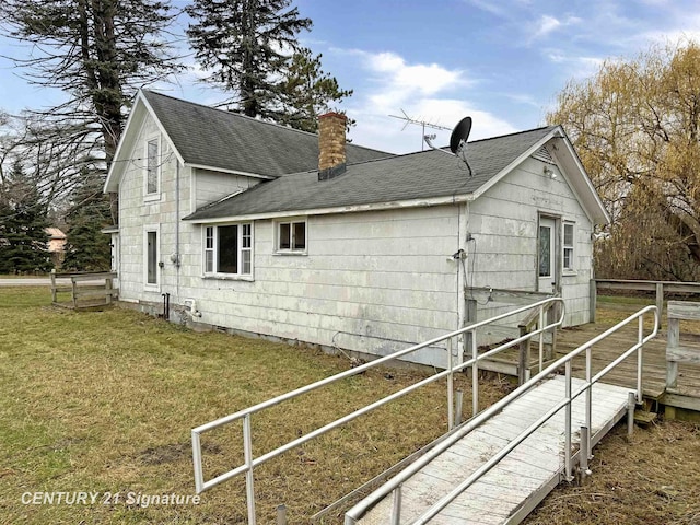 view of property exterior with a yard