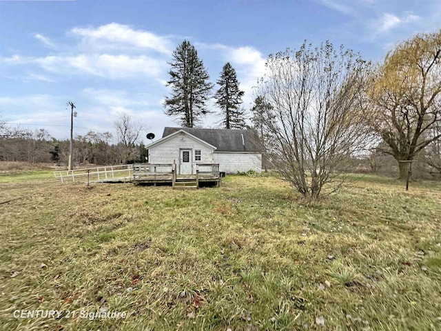 view of yard featuring a wooden deck and a rural view