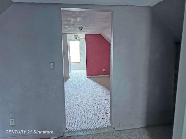 bonus room featuring carpet floors and vaulted ceiling