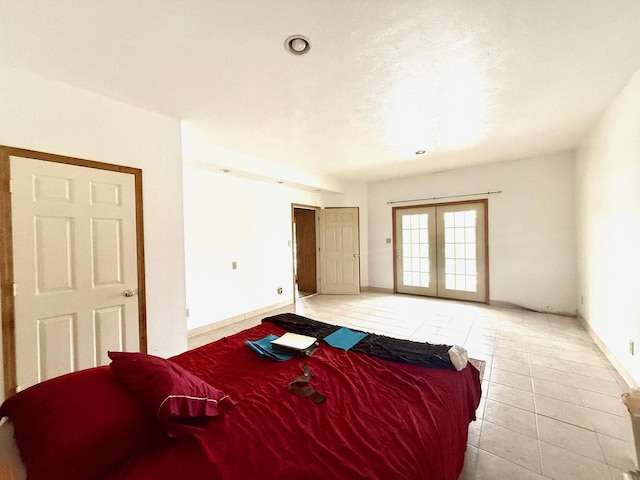 tiled bedroom with french doors and access to exterior