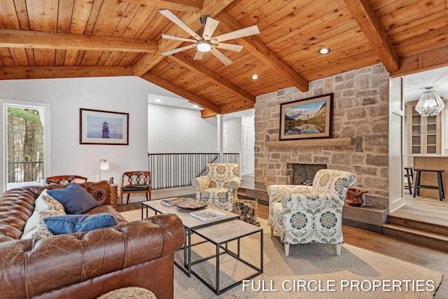 living room with ceiling fan, wooden ceiling, vaulted ceiling with beams, light hardwood / wood-style floors, and a fireplace