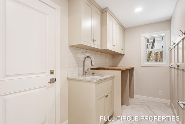 washroom with light tile patterned floors and sink