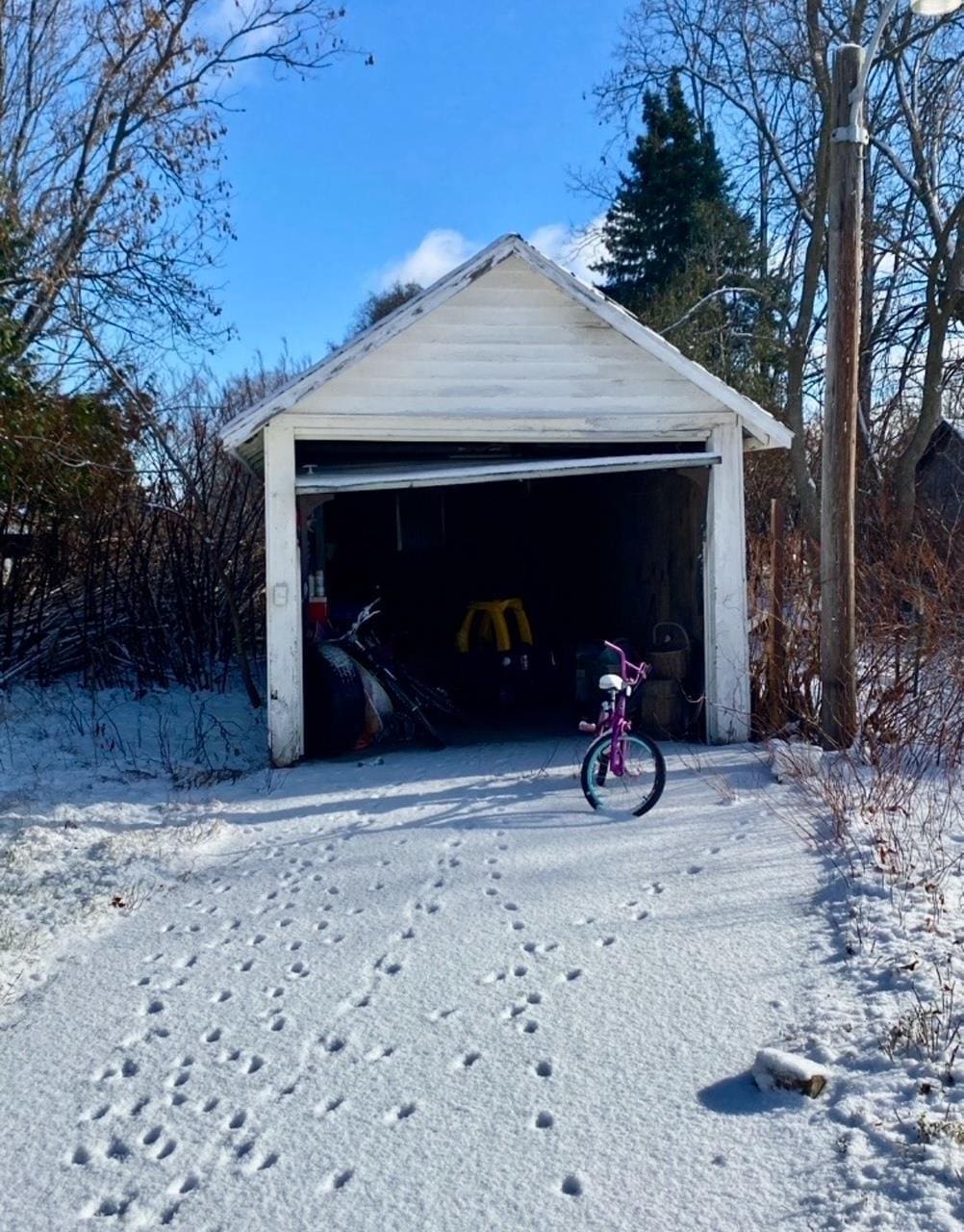 view of snow covered garage