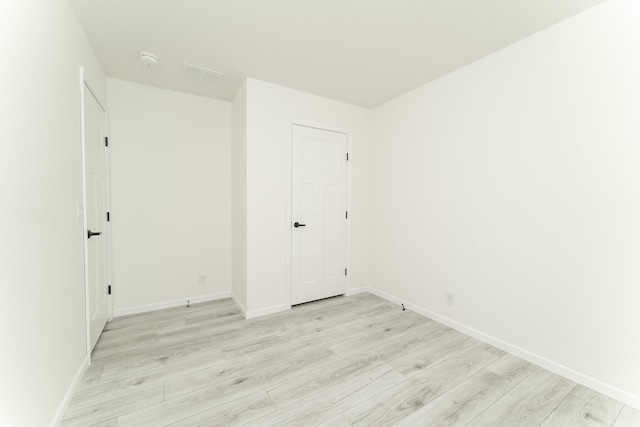 spare room with light wood-type flooring