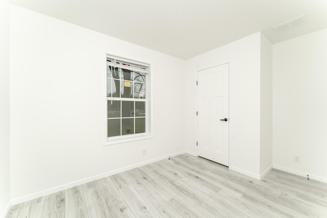 unfurnished room featuring light hardwood / wood-style floors