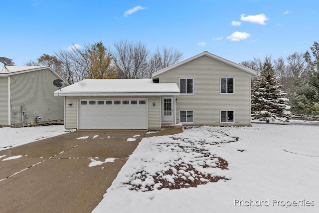 split level home featuring a garage