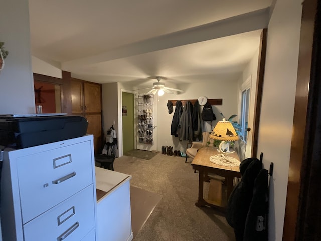 interior space with ceiling fan and carpet flooring