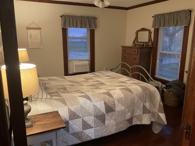 bedroom with cooling unit and ornamental molding