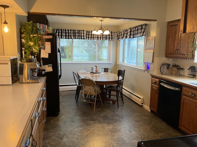 kitchen featuring black appliances, hanging light fixtures, a baseboard heating unit, and an inviting chandelier