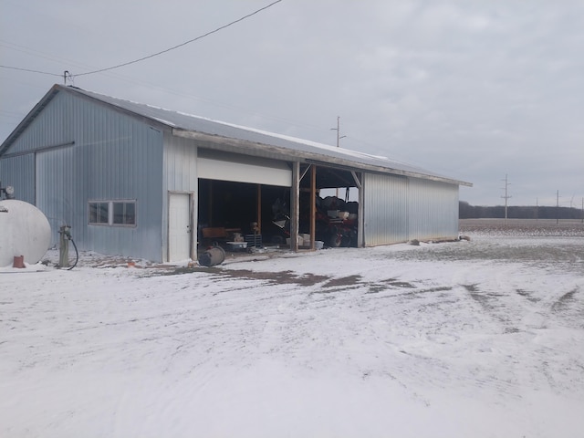 view of snow covered garage