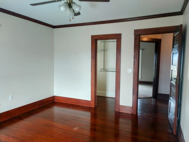 unfurnished room with crown molding, dark hardwood / wood-style floors, and ceiling fan