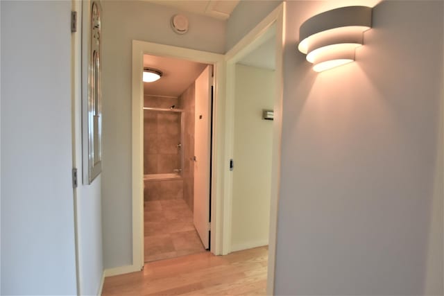 hallway featuring light hardwood / wood-style flooring