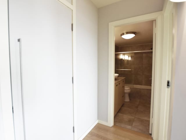 hallway featuring light wood-type flooring