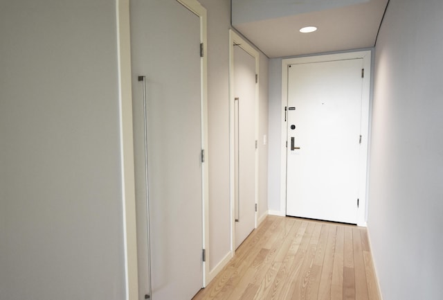 hallway with light wood-type flooring