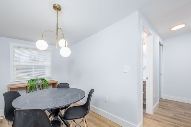 dining space featuring light wood-type flooring