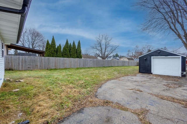 view of yard featuring an outbuilding and a garage