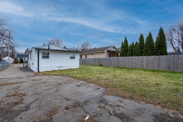 back of house with a yard