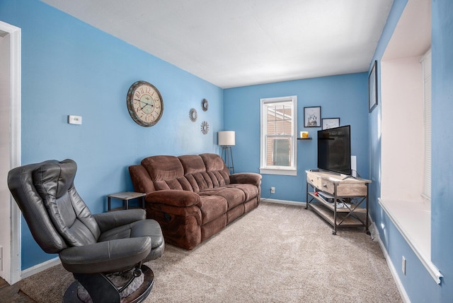 living room featuring light carpet