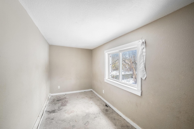 empty room featuring a textured ceiling