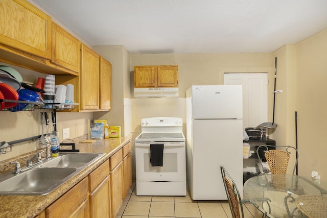 kitchen featuring sink, light tile patterned floors, and white appliances