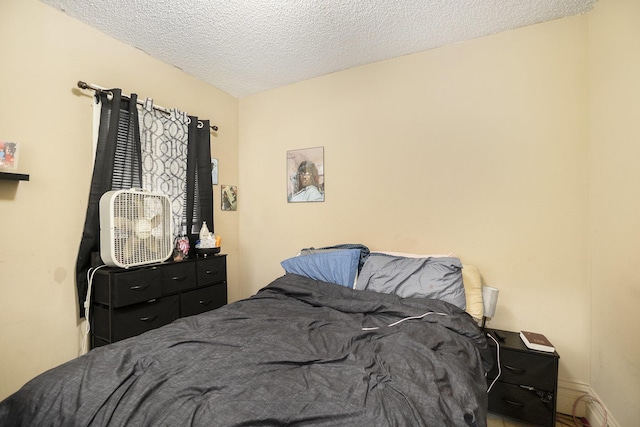 bedroom featuring a textured ceiling