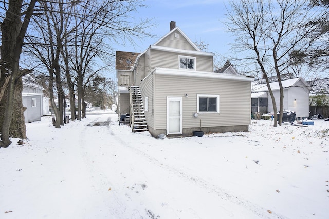 view of snow covered house