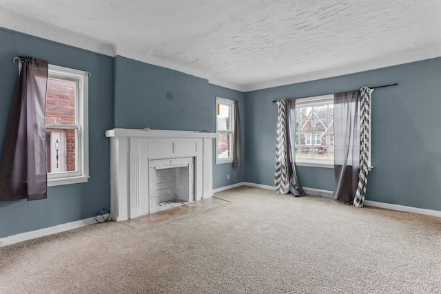 unfurnished living room with carpet and a textured ceiling