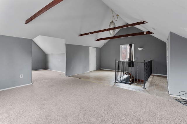 bonus room featuring light carpet and lofted ceiling with beams