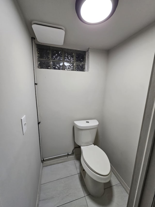 bathroom with tile patterned floors and toilet