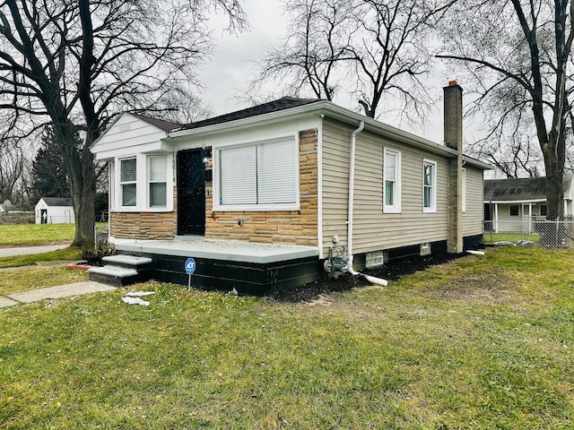 view of home's exterior with a yard