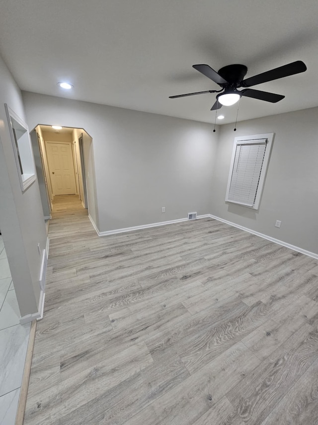 unfurnished room featuring ceiling fan and light hardwood / wood-style flooring