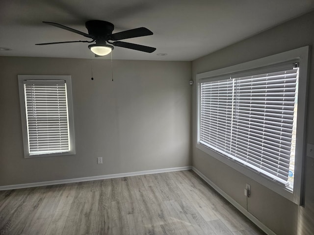 unfurnished room featuring ceiling fan and light wood-type flooring